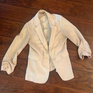 Woman’s tan blazer